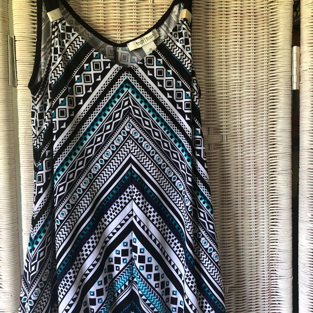 Black house white market. One x- small tank. Like new condition.